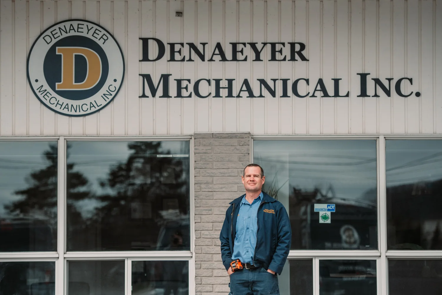 Denaeyer Mechanical team member outside the company’s shop.