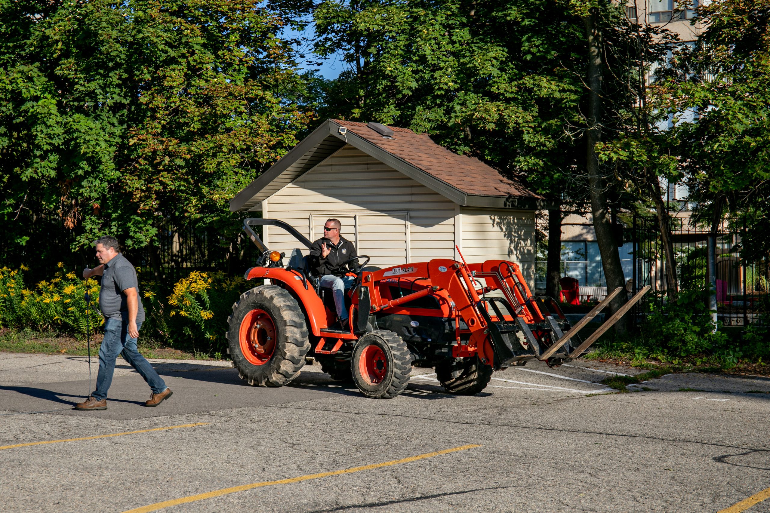 Crew and a loader in the Waterpark Place project staging area.