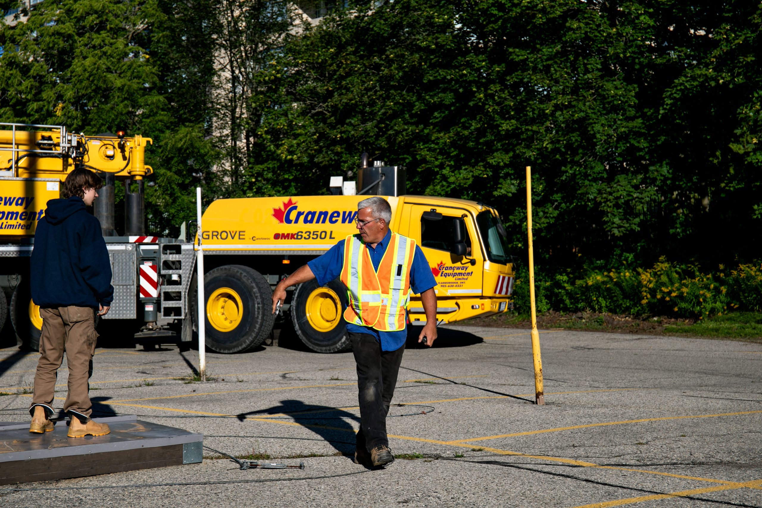 Crew members working near the crane at Waterpark Place.