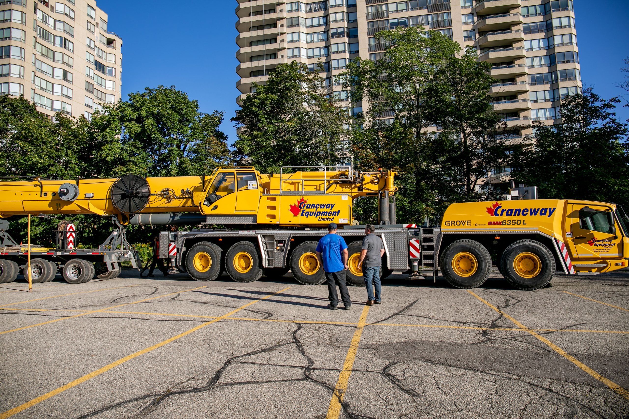 Crew standing beside the mobile crane at Waterpark Place.
