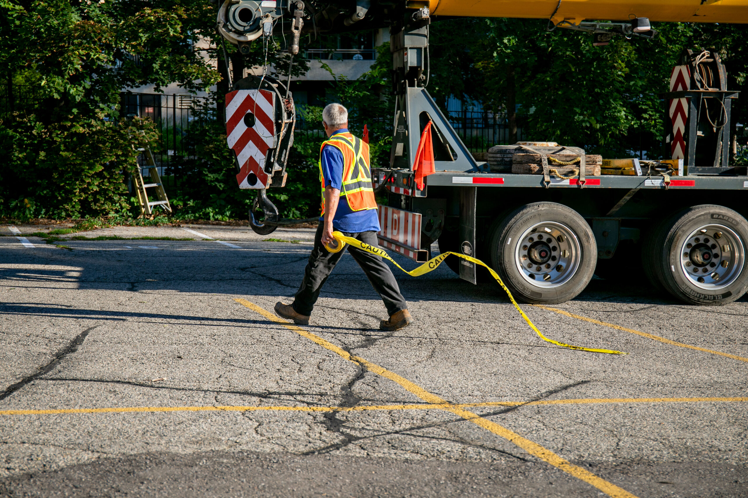 Crew member handling a line beside the crane at Waterpark Place.