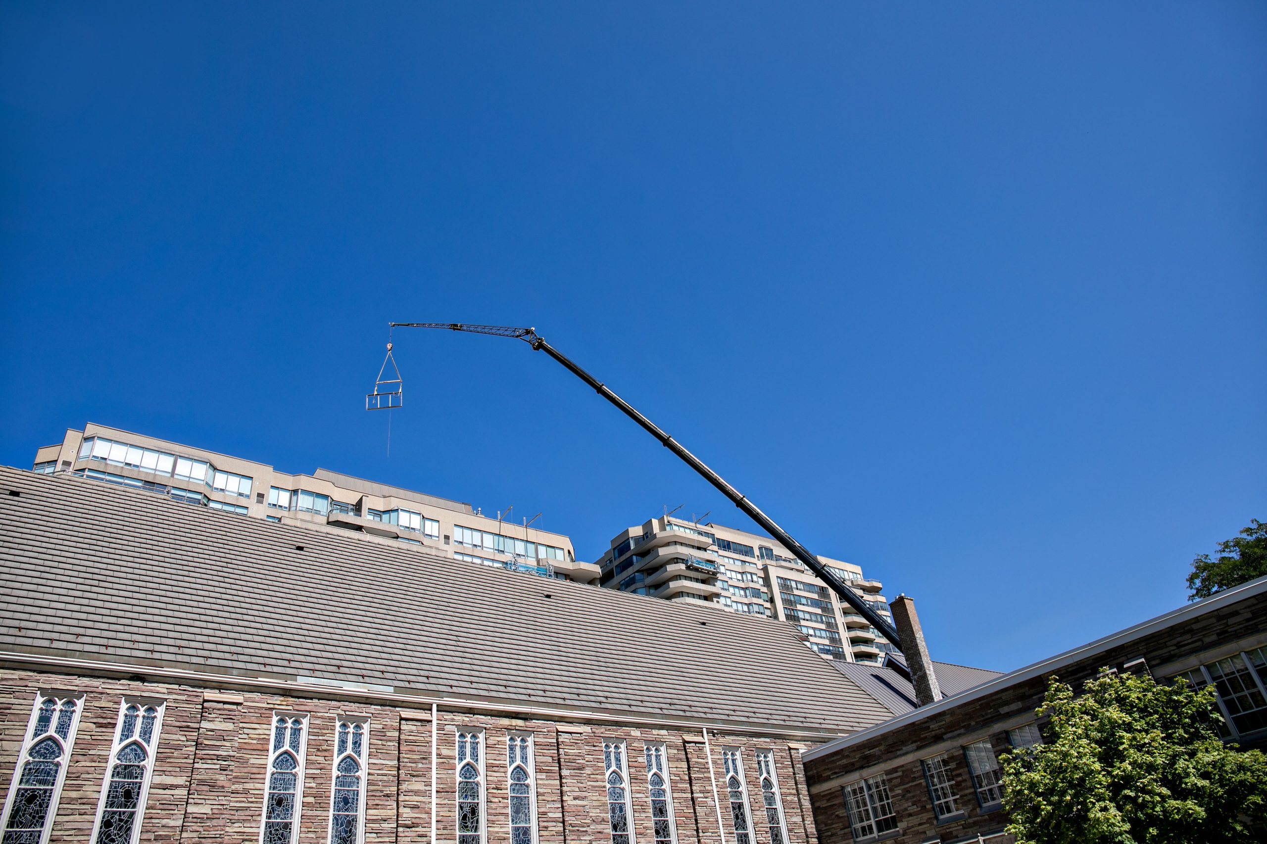 Extended crane boom visible above the buildings at Waterpark Place.